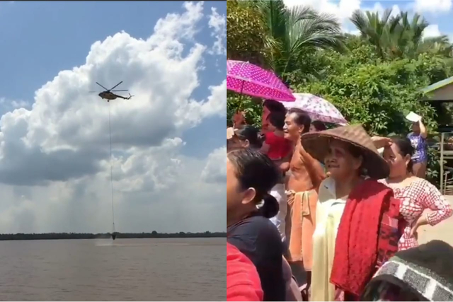 Warga terhibur menyaksikan helikopter yang mengambil air. Foto: Instagram Sambas Informasi