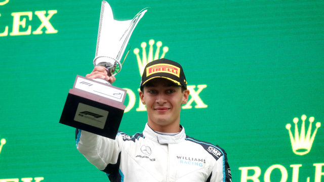 Pembalap Williams George Russell merayakan di podium setelah finis kedua pada balapan F1 GP Belgia di Spa-Francorchamps, Spa, Belgia, Minggu (29/8). Foto: Christian Hartmann/REUTERS