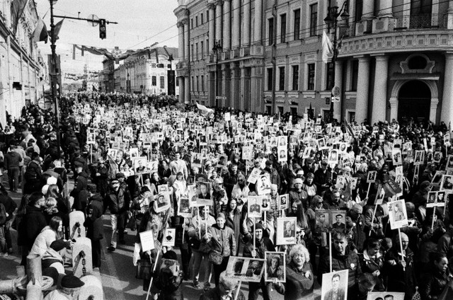 Photo by Vladimir Konoplev : https://www.pexels.com/photo/grayscale-photo-of-people-on-street-holding-signs-and-posters-12179210/