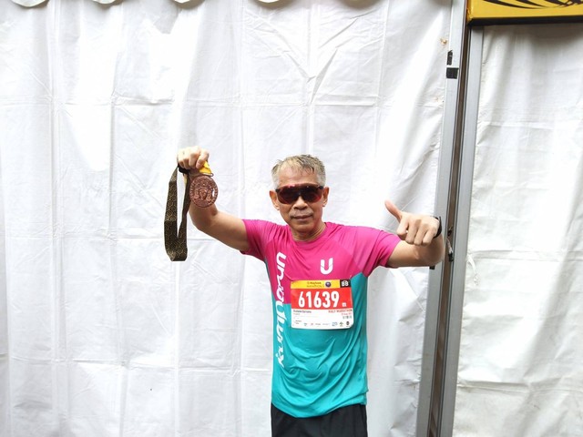 Presiden Komisaris kumparan, Budiono Darsono, mengikuti Maybank Marathon 2022 di Bali, Minggu (28/8). Foto: Katondio Bayumitra Wedya/kumparan