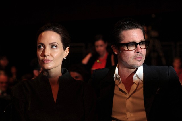 Angelina Jolie dan Brad Pitt menghadiri hari keempat KTT Global  di London pada 13 Juni 2014. Foto: Carl Court/AFP
