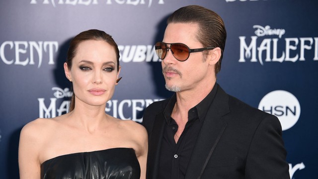 Angelina Jolie dan Brad Pitt tiba untuk pemutaran perdana dunia Disney "Maleficent," di El Capitan Theatre di Hollywood, California pada 28 Mei 2014. Foto: Robyn Beck / AFP