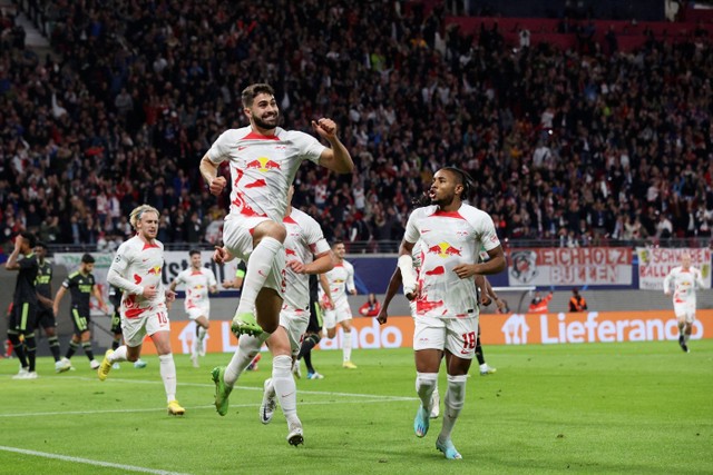 Selebrasi pemain RB Leipzig usai mencetak gol ke gawang Real Madrid pada pertandingan Grup F Liga Champions di Red Bull Arena, Leipzig, Jerman. Foto: Ronny HARTMANN / AFP