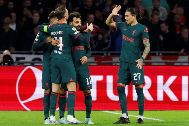 Selebrasi pemain Liverpool usai mencetak gol ke gawang Ajax Amsterdam pada pertandingan Grup A Liga Champions di Johan Cruijff Arena, Amsterdam, Belanda. Foto: Piroschka Van De Wouw/REUTERS