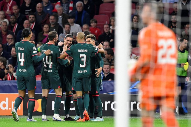 Selebrasi pemain Liverpool usai mencetak gol ke gawang Ajax Amsterdam pada pertandingan Grup A Liga Champions di Johan Cruijff Arena, Amsterdam, Belanda. Foto: JOHN THYS / AFP