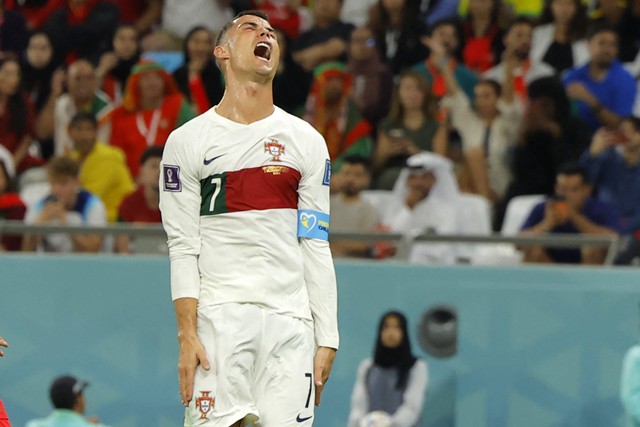 Cristiano Ronaldo bereaksi selama pertandingan sepak bola Grup H Piala Dunia Qatar 2022 antara Korea Selatan dan Portugal. Foto: Odd Andersen/AFP