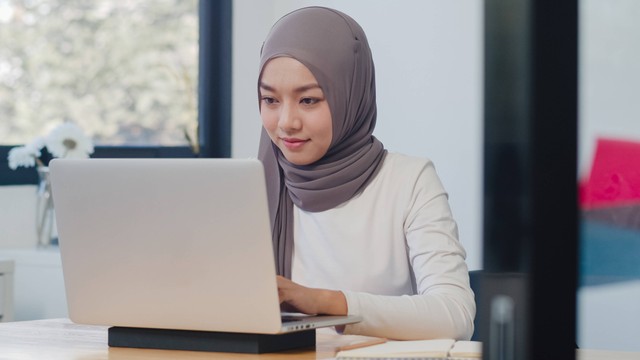 Photo by tirachardz on Freepik via https://www.freepik.com/free-photo/beautiful-asian-muslim-lady-casual-wear-working-using-laptop-modern-new-normal-office_15113026.html