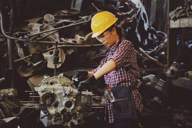 Photo by Chevanon Photography: https://www.pexels.com/photo/woman-wears-yellow-hard-hat-holding-vehicle-part-1108101/
