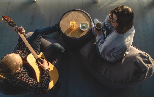 <a href="https://www.freepik.com/free-photo/young-man-plays-guitar-girl-top-view_29319904.htm#query=music%20cafe&position=20&from_view=search&track=sph">Image by pvproductions</a> on Freepik