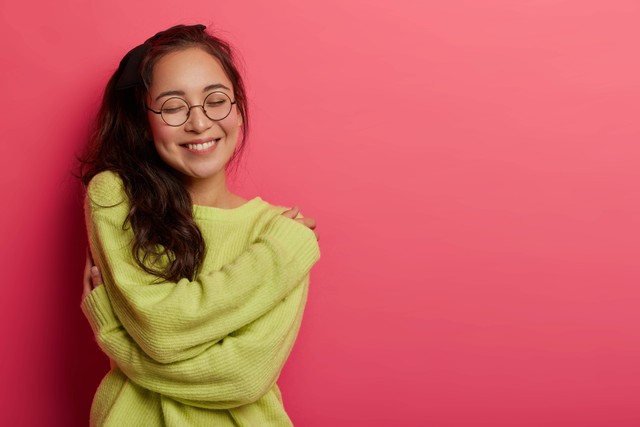 https://www.freepik.com/free-photo/photo-charming-woman-expresses-self-love-care-enjoys-wearing-new-soft-green-sweater-embraces-own-body-recalls-romantic-moment-with-boyfriend_12930212.htm#query=self%20love&position=1&from_view=search&track=sph