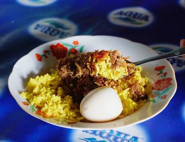 Ilustrasi nasi kuning. Foto: Safira/kumparan