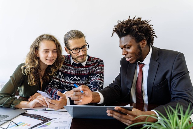 Photo by Antoni Shkraba from Pexels: https://www.pexels.com/photo/man-in-black-suit-jacket-sitting-beside-a-couple-5816293/