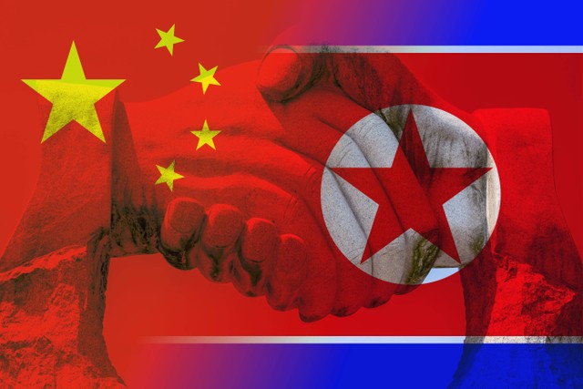 The chinese and north korean flag partnership concept. Source: BeeBright/shutterstock