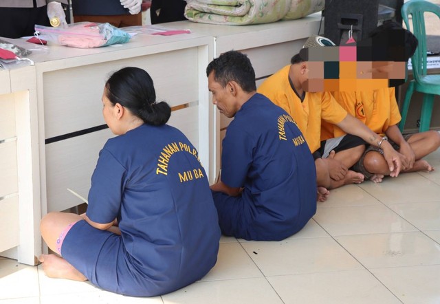 Pasangan suami istri di Muba yang membunuh anak angkat mereka. (ist)