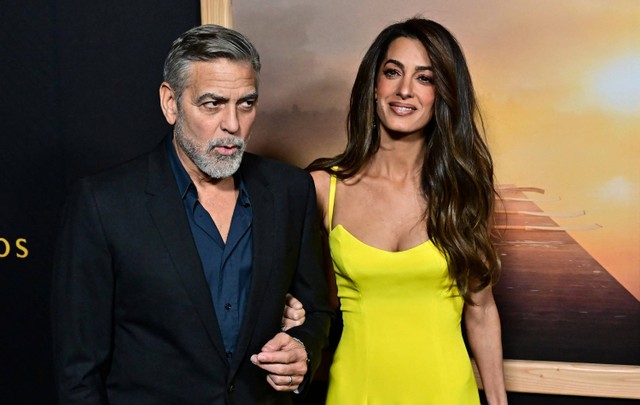 Aktor AS George Clooney dan istrinya Amal Clooney. Foto: FREDERIC J. BROWN / AFP