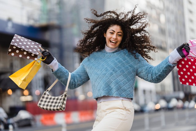 Illustration of Women and Branded Goods by https://www.pexels.com/photo/happy-woman-jumping-with-shopping-bags-6567607/
