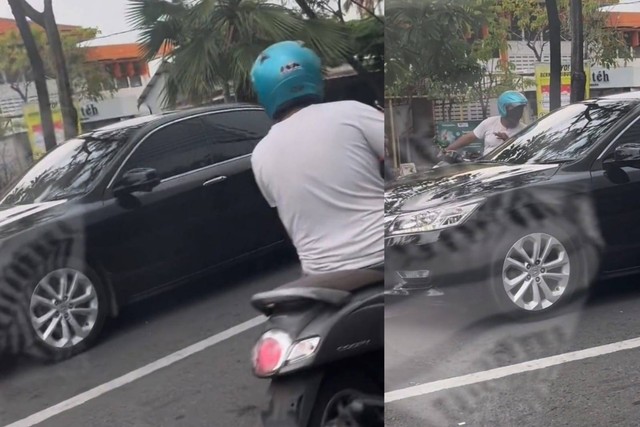 Tangkapan layar aksi pengendara motor yang meminta uang dengan modus mengetuk  kaca mobil di salah satu perempatan lampu merah di Surabaya.