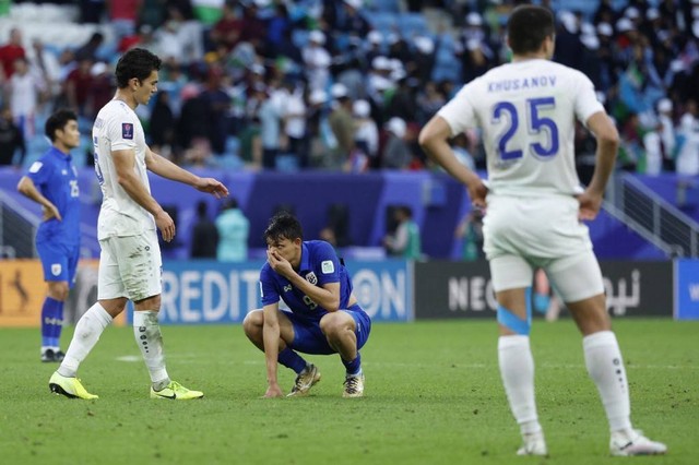 Uzbekistan vs Thailand di Piala Asia. Dok: KARIM JAAFAR / AFP