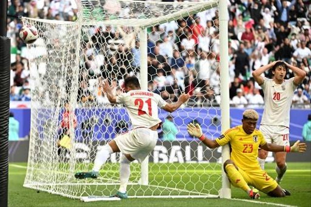 Iran vs Jepang di Piala Asia. Dok: HECTOR RETAMAL / AFP