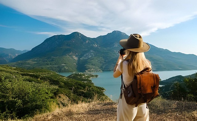 https://www.shutterstock.com/id/image-photo/woman-photographer-big-backpack-taking-photo-2176161815