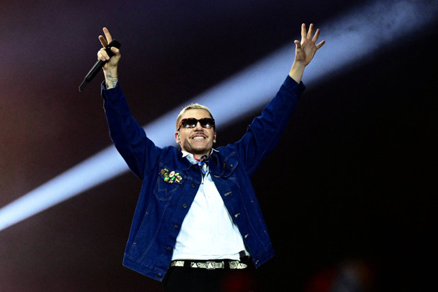 Rapper dan penyanyi AS Benjamin Hammond Haggerty alias Macklemore. Foto: MICHAL CIZEK / AFP