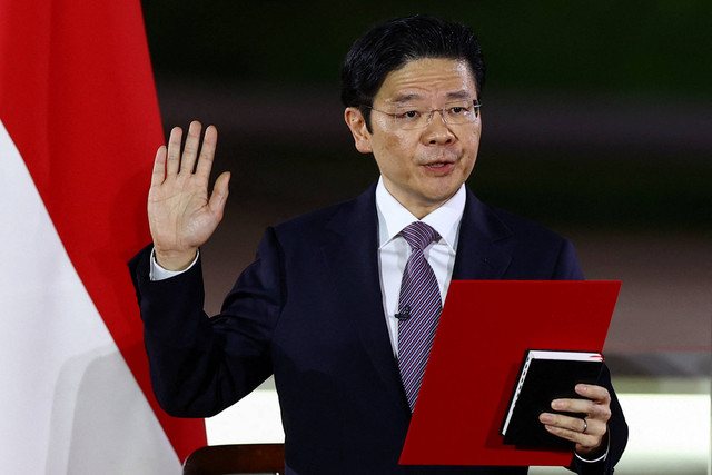 Wakil Perdana Menteri Singapura Lawrence Wong dilantik sebagai Perdana Menteri keempat Singapura di Istana, Singapura, Rabu (15/5/2024). Foto: Edgar Su/Reuters