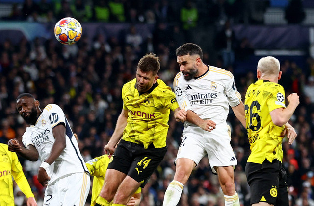 Duel Niclas Fuellkrug Dani Carvajal saat laga Real Madrid vs Borussia Dortmund dalam final Liga Champions 2023/24 di Stadion Wembley, Inggris, Minggu (2/6) dini hari WIB. Foto: Carl Recine/REUTERS