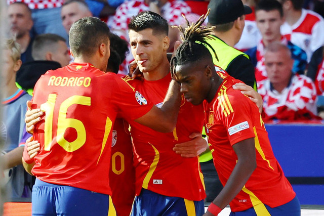 Pemain Spanyol Alvaro Morata merayakan gol pertamanya bersama rekan setimnya saat hadapi Kroasia di Olympiastadion Berlin, Berlin, Jerman, Sabtu (15/6/2024). Foto: Lisi Niesner/Reuters