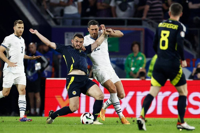 Swiss vs Skotlandia di Piala Eropa. Foto: Kenzo TRIBOUILLARD / AFP