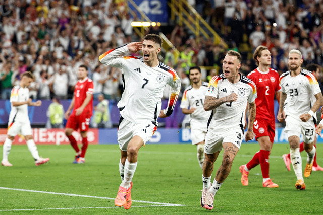 Selebrasi pemain Timnas Jerman Kai Havertz usai mencetak gol ke gawang Timnas Denmark pada pertandingan 16 besar Piala Eropa 2024 di Signal Iduna Park, Dortmund, Jerman, Minggu (30/6/2024). Foto: KENZO TRIBOUILLARD / AFP