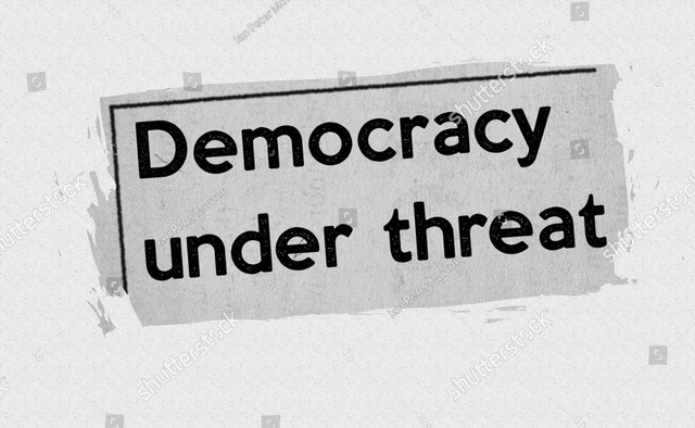 Ilustrasi demokrasi dibawah ancaman. Foto:shutterstock.com/id/image-illustration/democracy-under-threat-current-breaking