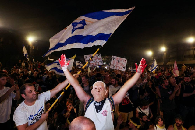 Aksi unjuk rasa warga Israel terkait konflik dengan Hamas di Tel Aviv, Minggu (1/9/2024). Foto: Florion Goga/REUTERS