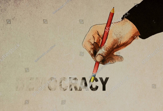 Ilustrasi demokrasi. Foto: shutterstock.com image-illustration/hand-holding-pencil-erasing-democracy