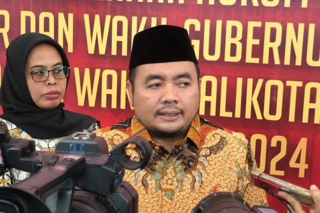 Ketua KPU RI Mochammad Afifuddin usai Rapat Koordinasi Penanganan Permasalahan Hukum dalam Penyelenggaraan Pemilihan Gubernur dan Wakil Gubernur, Bupati dan Wakil Bupati Serta Walikota dan Wakil Walikota di Wilayah Jawa Barat, Rabu (11/9/2024). Foto: Robby Bouceu/kumparan