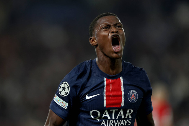Pemain Paris Saint Germain Nuno Mendes berselebrasi usai mencetak gol pada pertandingan Liga Champions melawan Girona di Stadion Parc des Princes, Paris, Prancis, Rabu (18/9/2024). Foto: Franck Fife/AFP