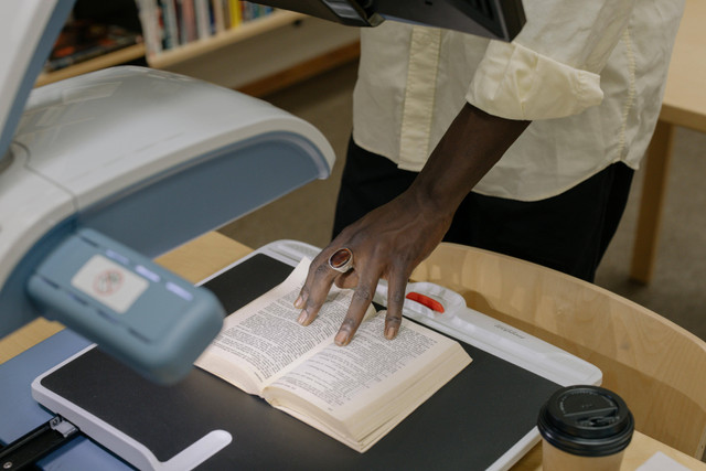 https://www.pexels.com/photo/person-in-white-button-up-shirt-holding-white-printer-paper-6334768/