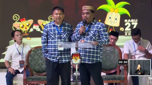 Pasangan calon Wali Kota dan Wakil Wali Kota Manado, Audy Karamoy-Lucky Datau, saat mengikuti debat perdana yang digelar KPU Manado. (foto: youtube KPU)