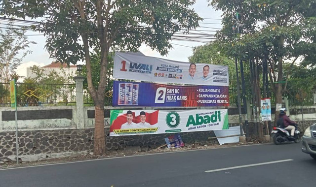 Banner tiga paslon pilkada kota Malang yang berjejer rukun di sebuah sudut kota (foto dokumentasi pribadi)