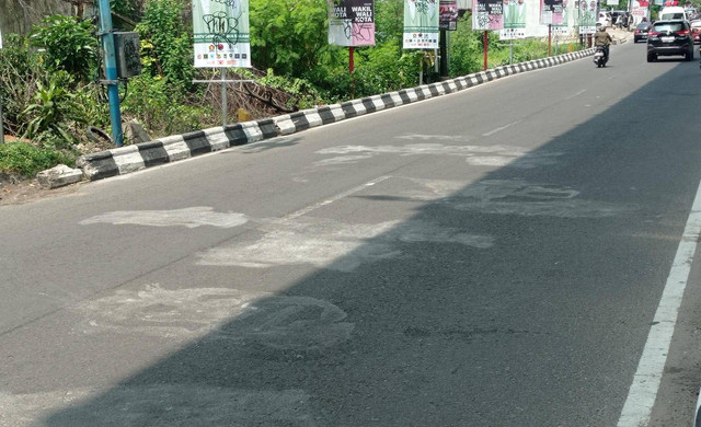 Coretan di jalan Angkatan 45 Palembang sudah dibersihkan, Foto : Abdullah Toriq/Urban Id