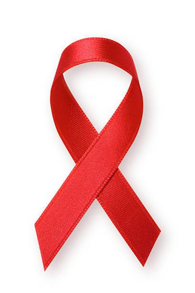 Pita merah sebagai simbol dan kampanye terhadap HIV/AIDS. Foto: istockphoto.com