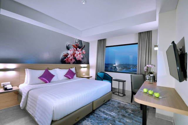 Deluxe Room Quest Prime Cikarang. Foto:  Archipelago