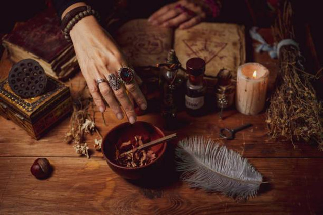 https://www.istockphoto.com/en/photo/female-witch-making-potion-on-dark-background-magic-bottles-with-potions-and-candles-gm1341442891-421193271