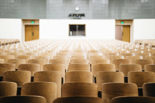 Empty Chairs in Theater Photo by Nathan Dumlao on Unsplash