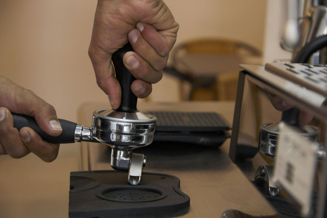 Photo by Sebastián Bastidas: https://www.pexels.com/photo/close-up-of-a-barista-using-a-coffee-tamper-19085739/