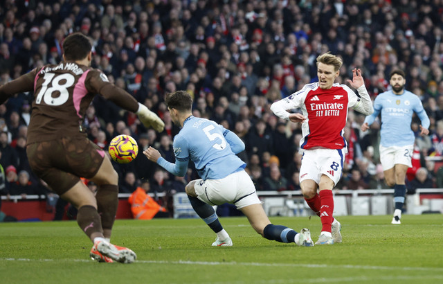 Arsenal vs Man City di Liga Inggris. Foto: Peter Cziborra/REUTERS