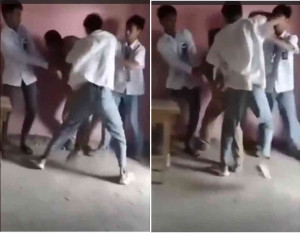 Tangkapan layar video yang memperlihatkan 3 siswa mengeroyok guru di kelas.