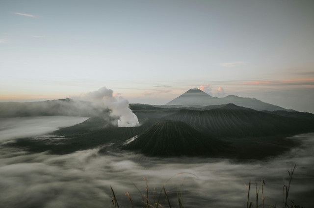 Photo by Roman Kirienko: https://www.pexels.com/photo/volcanic-mountains-with-steam-coming-out-8775535/