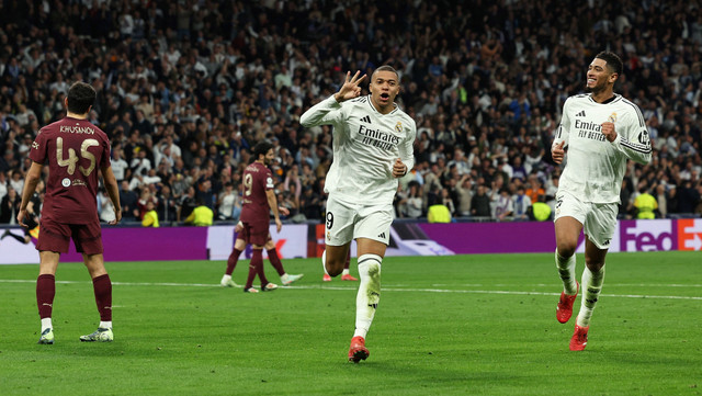 Hattrick Kylian Mbappe saat Real Madrid vs Man City dalam laga leg kedua playoff Fase Gugur Liga Champions 2024/25 di Estadio Santiago Bernabeu pada Kamis (20/2) dini hari WIB.  Foto: REUTERS/Violeta Santos Moura