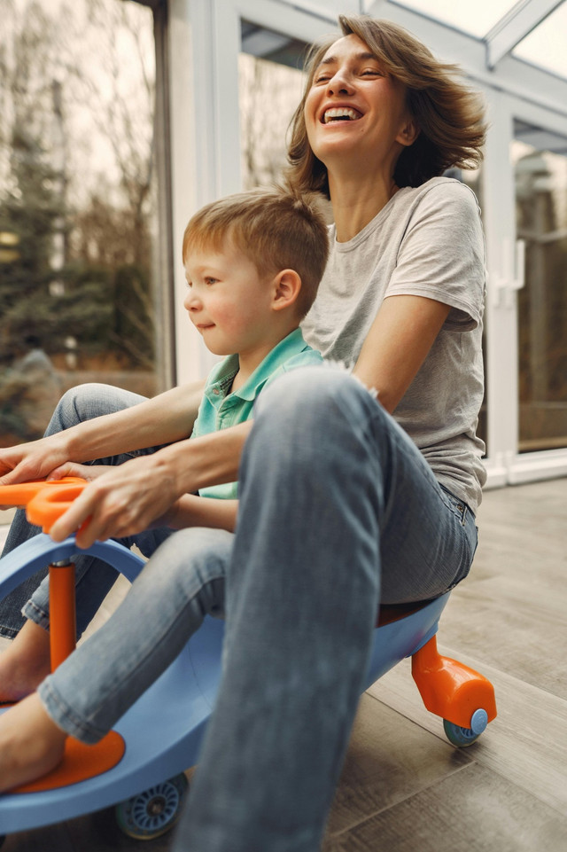 Happy Family // Sumber: https://www.pexels.com/photo/mother-and-son-riding-a-twist-car-3985228/