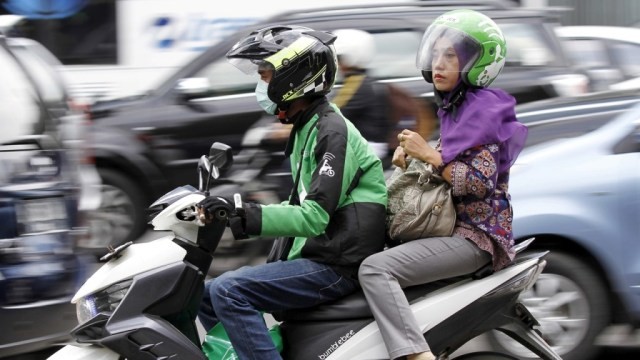 Ilustrasi ojek. (Foto: Garry Lotulung/Reuters)